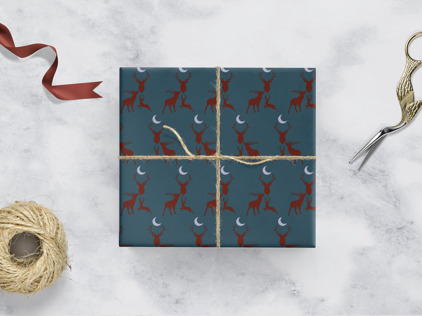 teal Wrapping paper with 3 red stags and a grey moon 